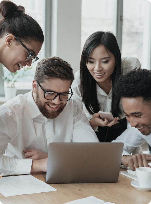 happy-young-business-colleagues-using-laptop-computer